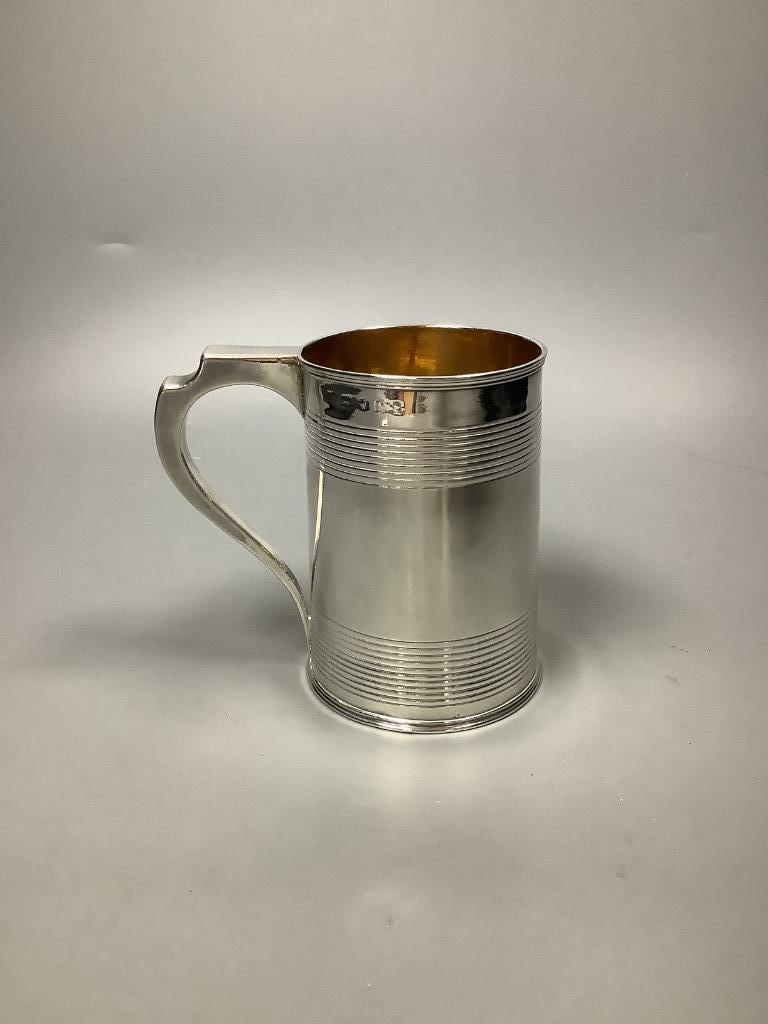A George III silver mug, with reeded bands, marks rubbed, circa 1800